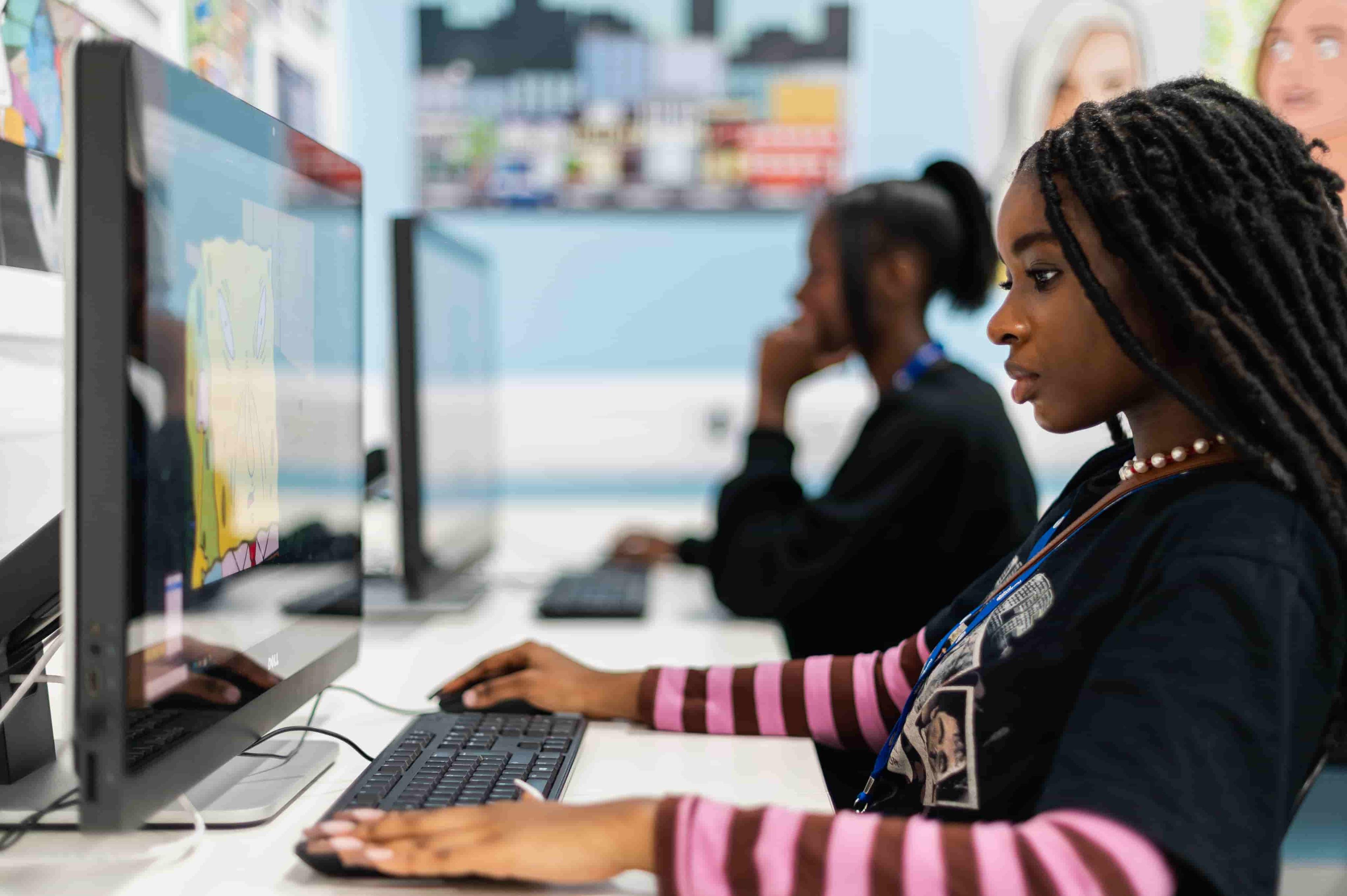 Student working focused on their computer