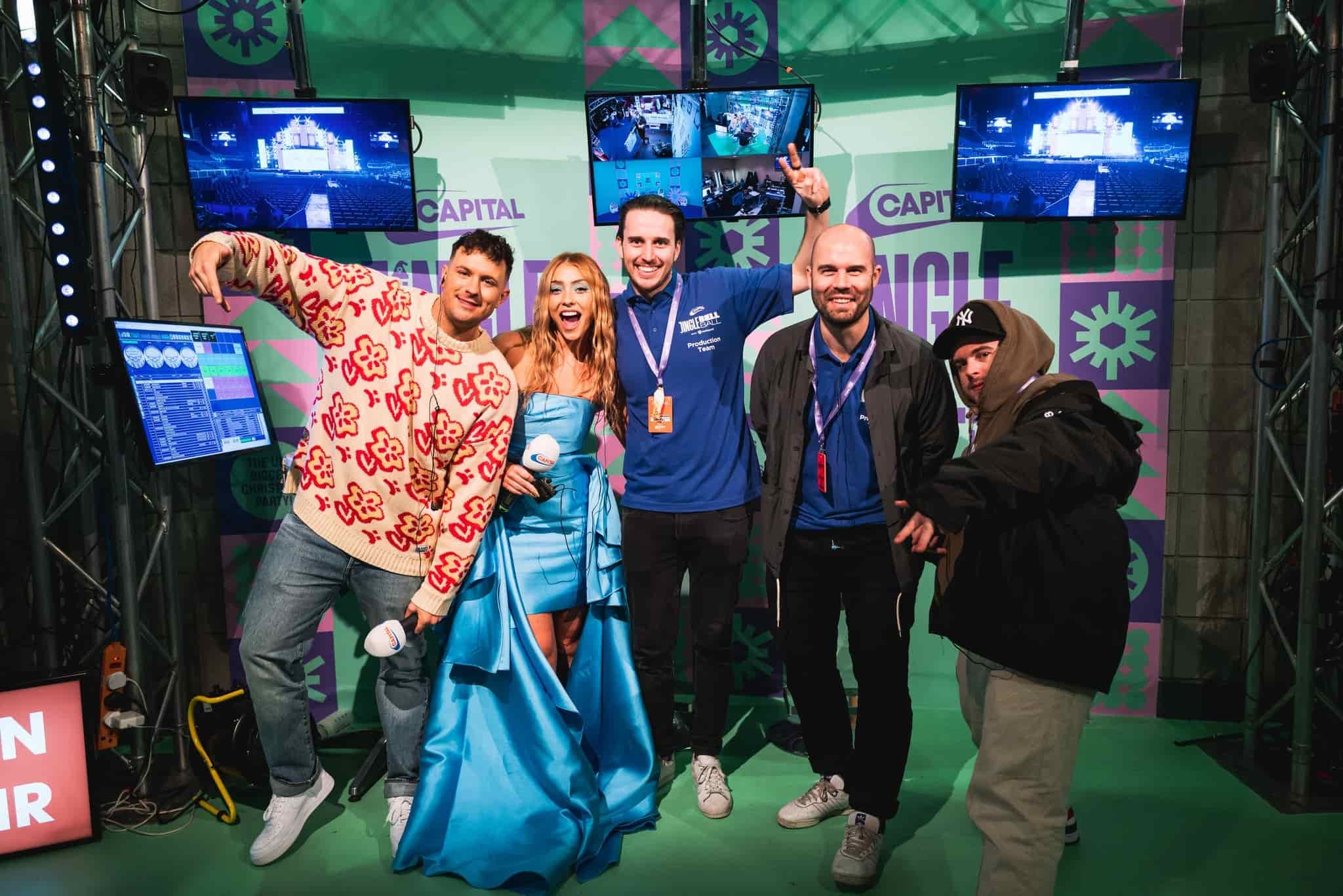 A joyful group of colleagues striking a pose for a memorable photo at an event.