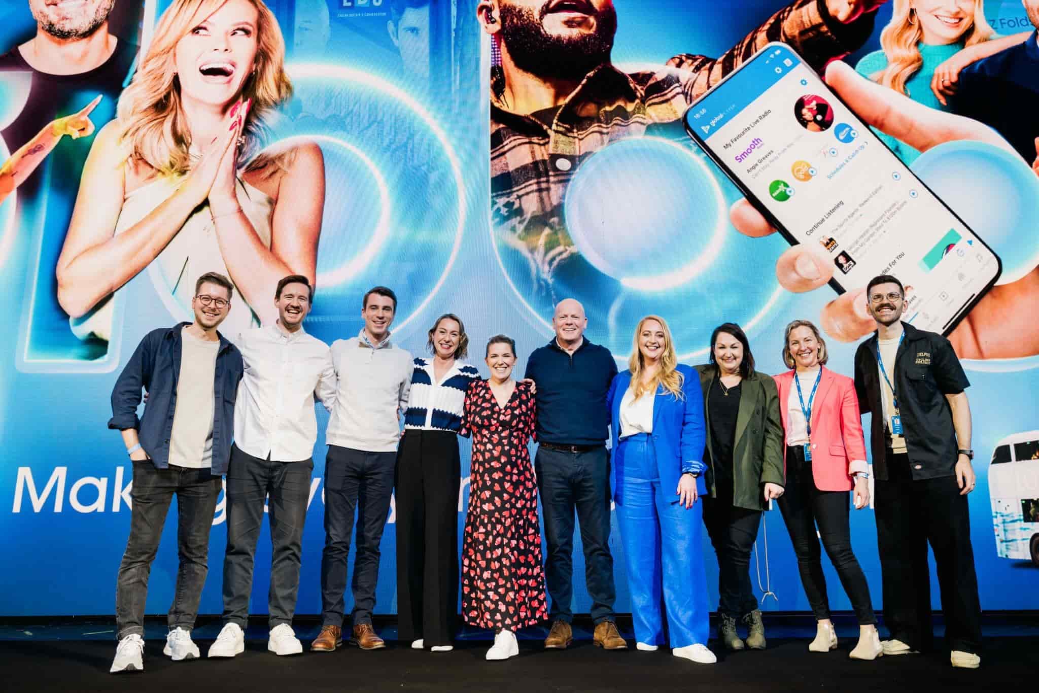 A joyful group of colleagues striking a pose for a memorable photo at an event.