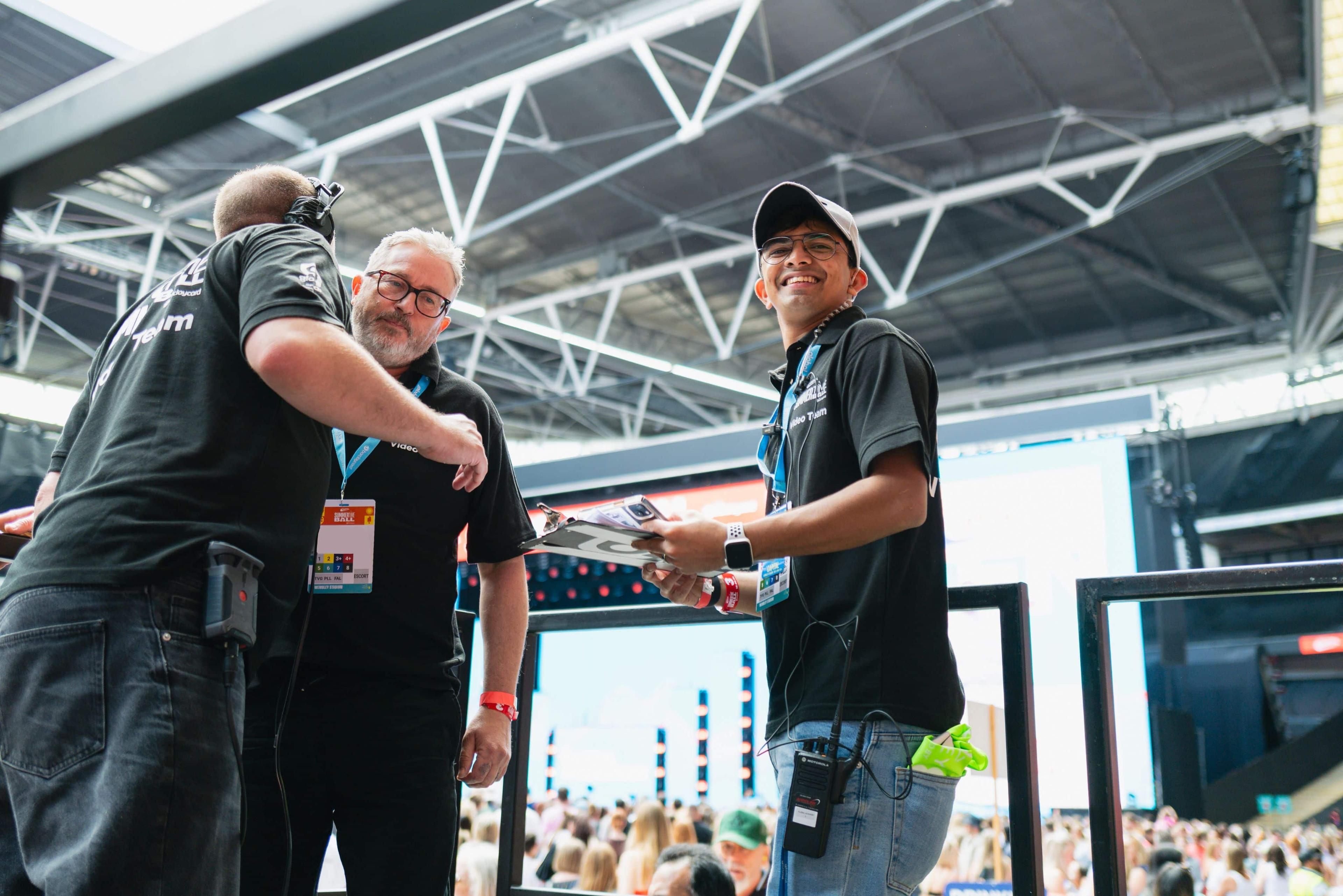 Colleagues smiling and working together at Global's Summertime ball