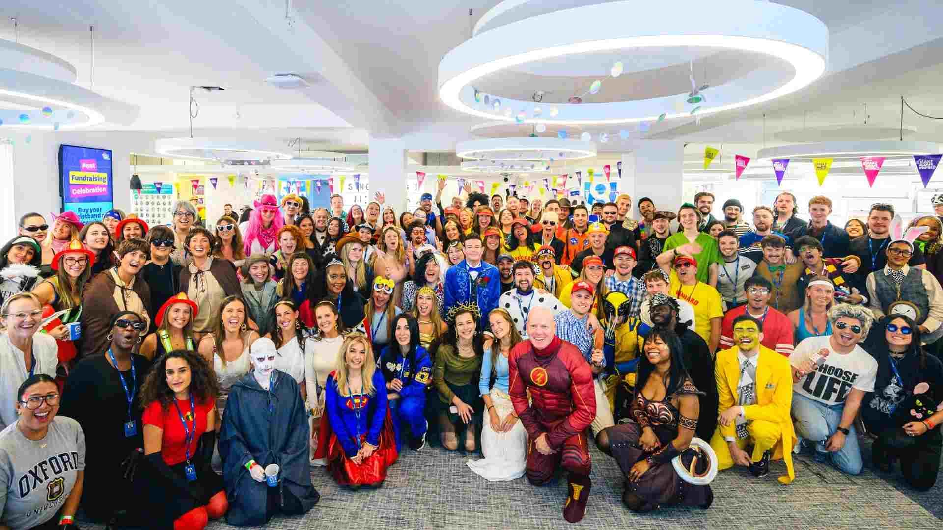 Large group of Globallers in colourful fancy dress